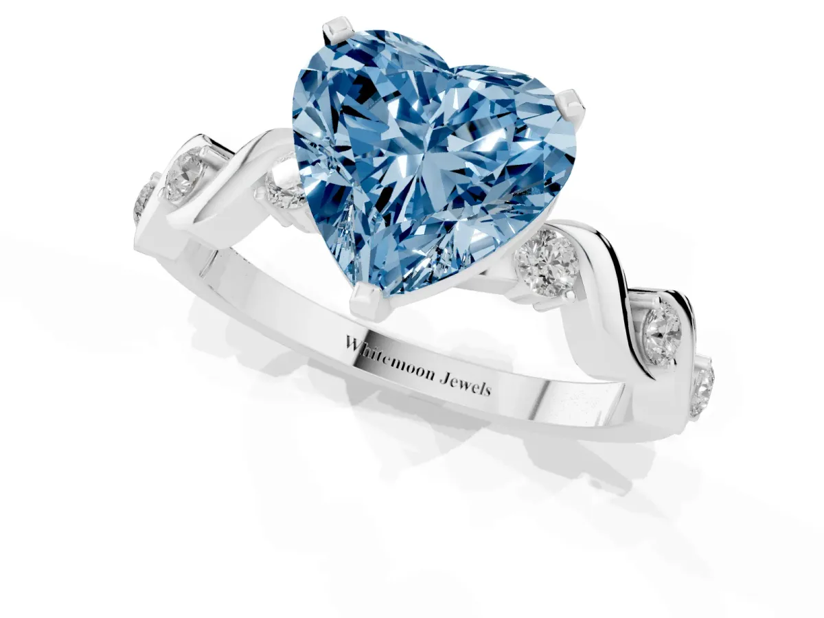 Fancy Blue Heart Cut Diamond Solitaire Twisted Band with Round Accents and Prong Setting Platinum