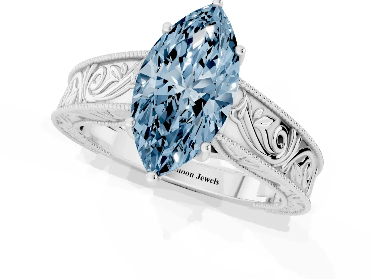 Fancy Blue Marquise Cut Diamond Solitaire Ring with Engraved Band and Four-Prong Setting White gold