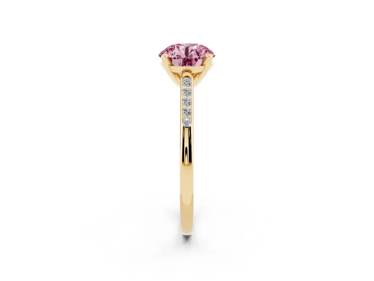 Fancy Pink Round Cut Diamond Solitaire Ring with Channel Set Round Band and Prong Setting Yellow gold