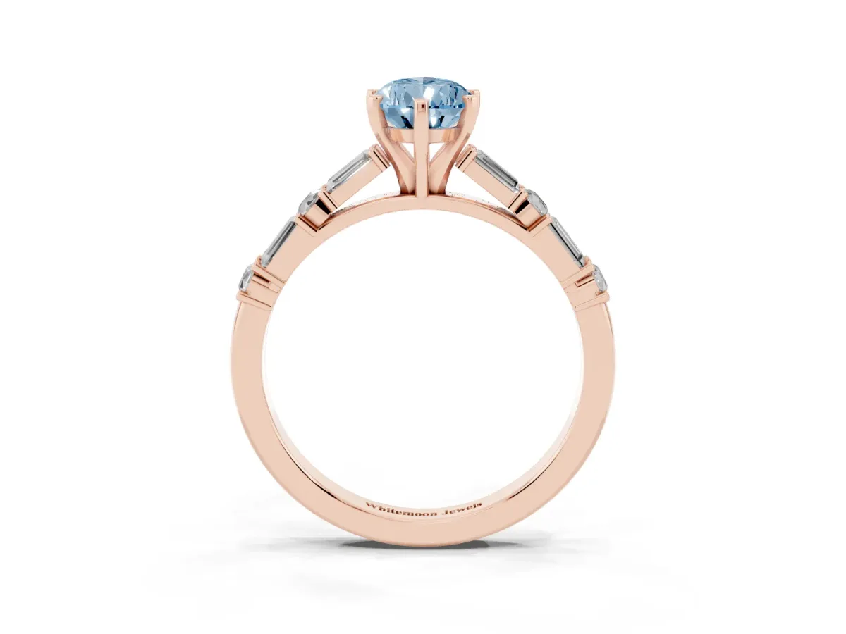 Fancy Blue Pear Cut Diamond Solitaire with Side Baguettes and Channel Set Band Rose gold