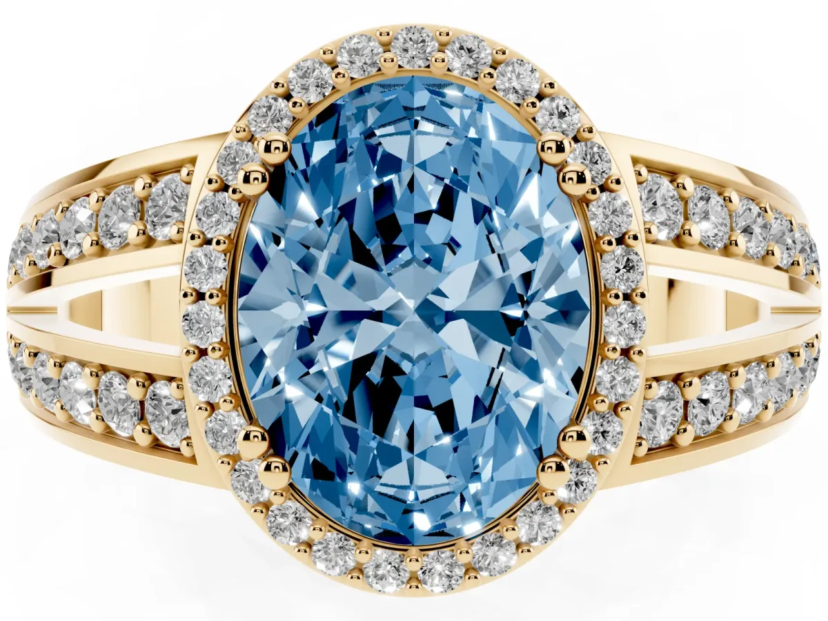 Fancy Blue Oval Cut Diamond Halo Ring with Split Shank Pavé Band and Four-Prong Setting Yellow gold