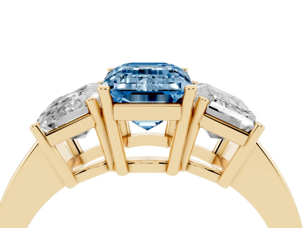 Fancy Blue Three-Stone Emerald Cut Cut Diamond Engagement Ring with Flat Band and Four-Prong Setting Yellow gold