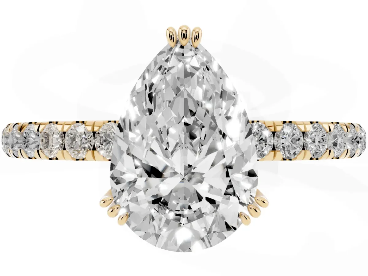 Pear Cut Brilliant Solitaire with Pavé Band and Claw Prong Setting Yellow gold