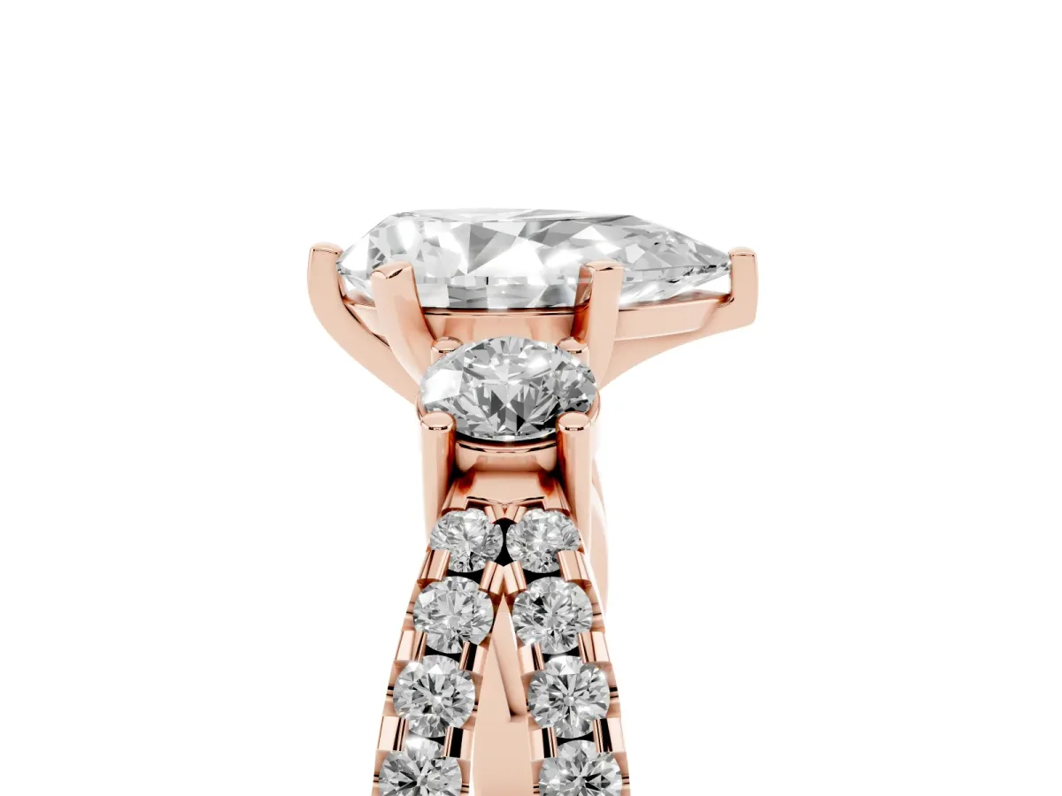 Pear Cut Diamond Three-Stone Ring with Pavé Split Shank and Four-Prong Setting Rose gold