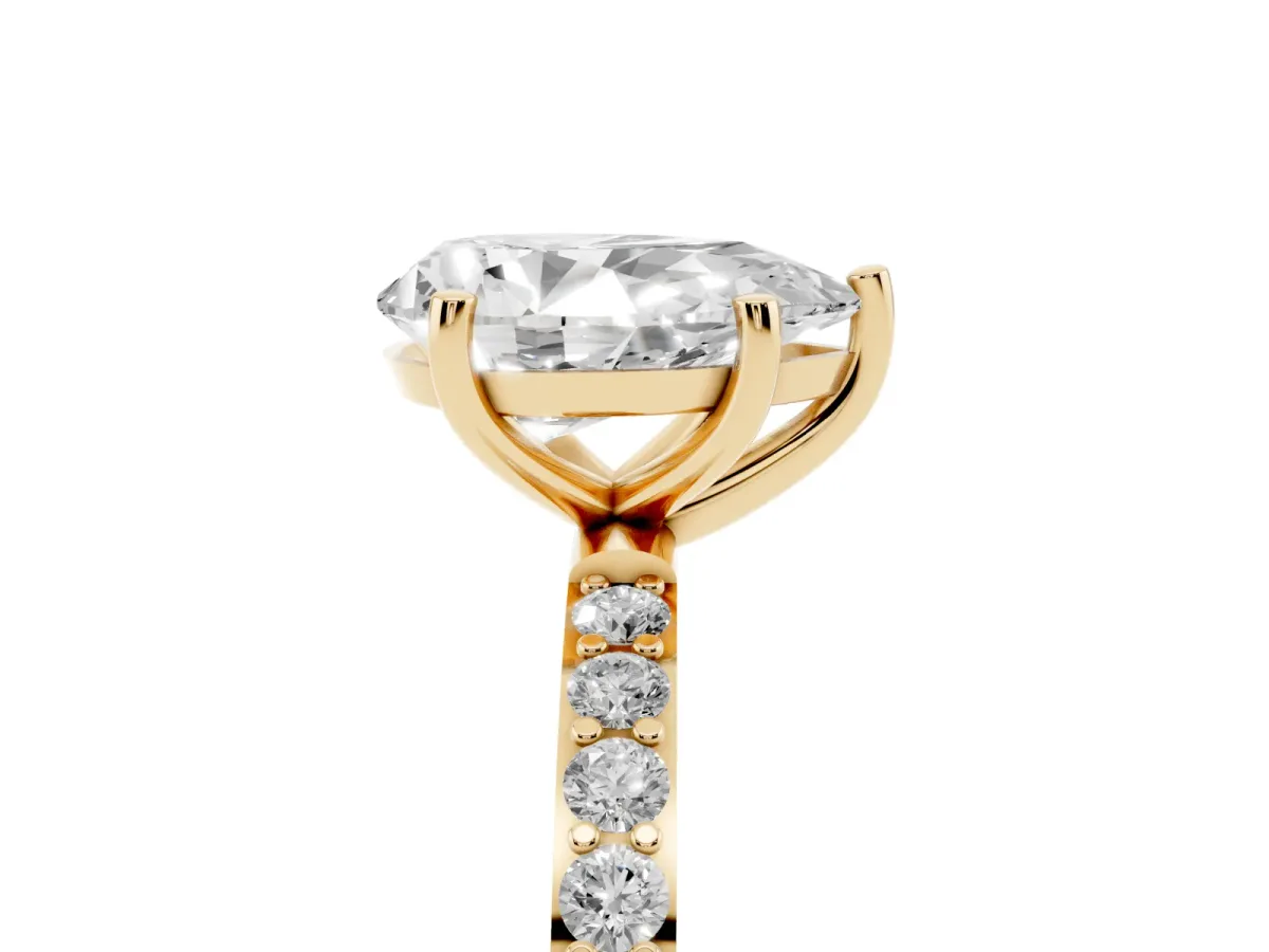 Pear Cut Diamond Solitaire Ring with Round Pavé Shoulders and Prong Setting Yellow gold