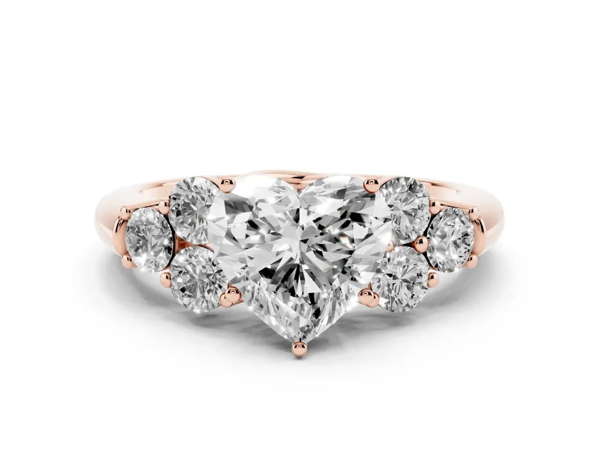Heart Cut Cut Diamond Cluster Ring with Round Accent Stones and Prong Setting on a Classic Band Rose gold