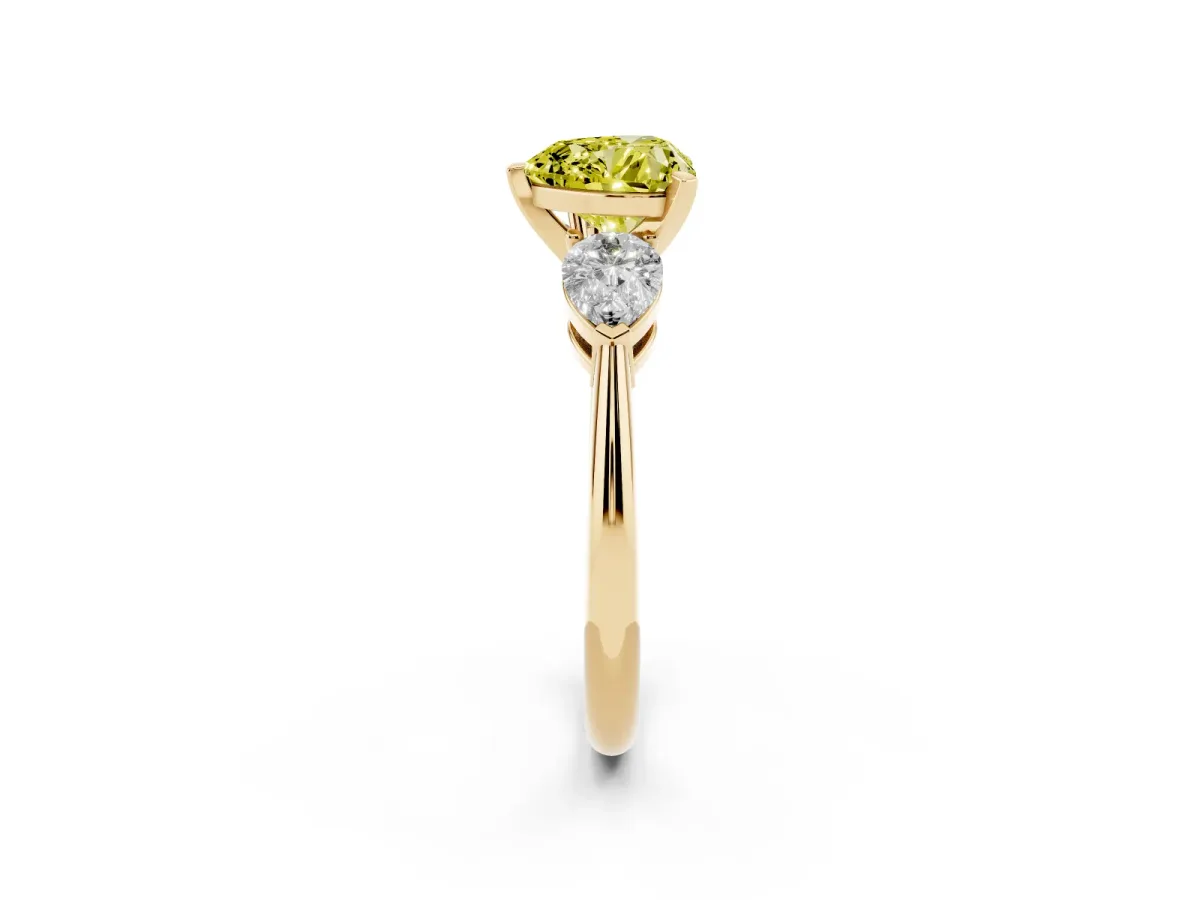 Fancy Yellow Three-Stone Heart Cut Diamond Ring with Pear Side Stones and Four-Prong Setting Yellow gold