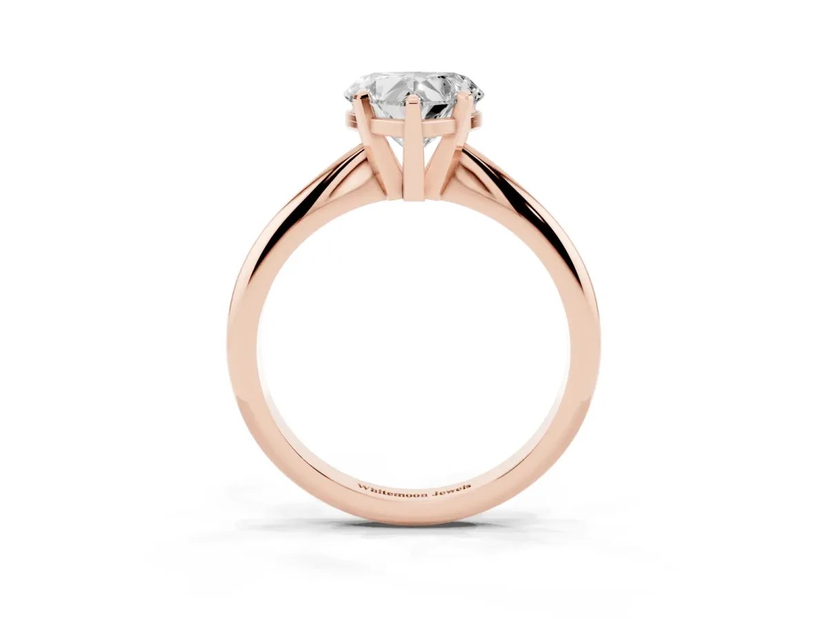 Heart Cut Cut Solitaire Ring with Four-Prong Setting on a Classic Band Rose gold
