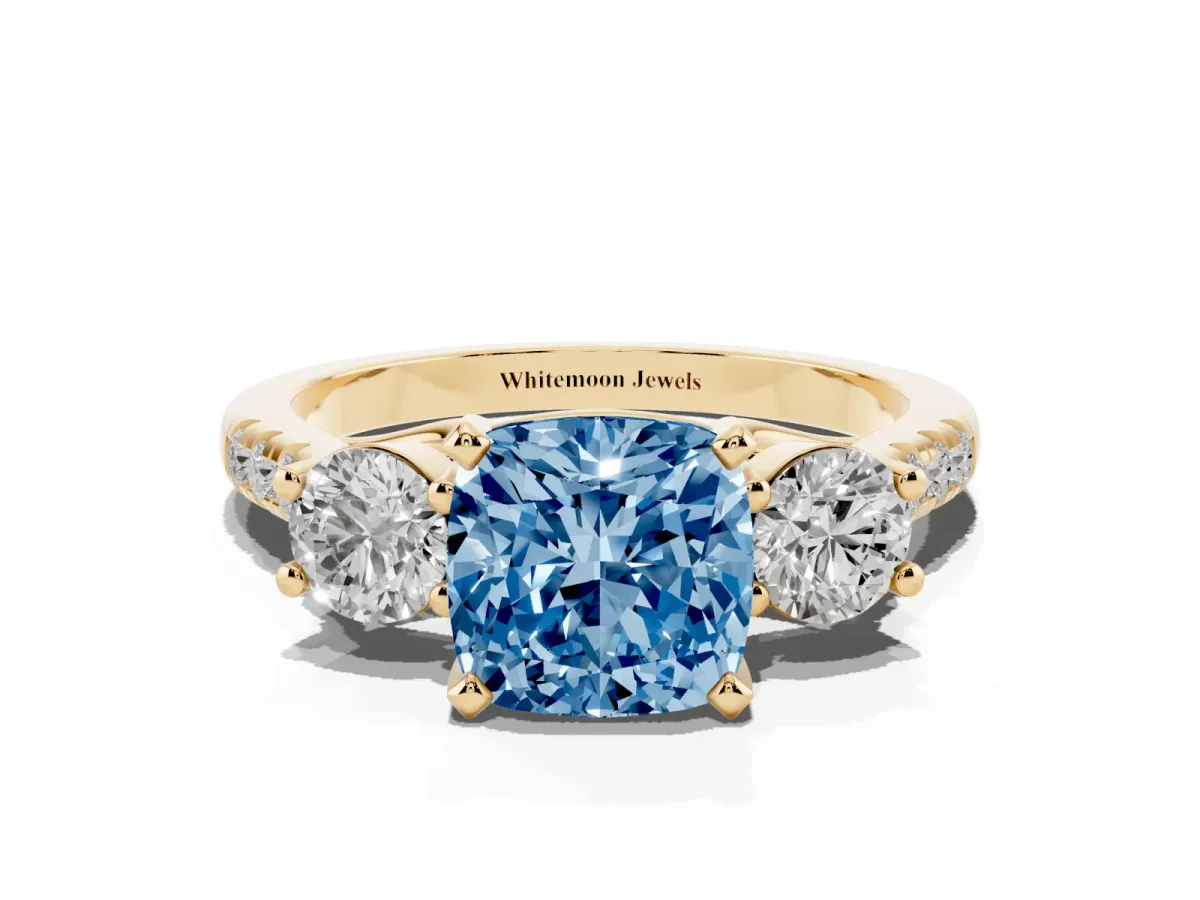 Fancy Blue Three-Stone Cushion Cut Diamond Pavé Band with Four-Prong Setting Yellow gold