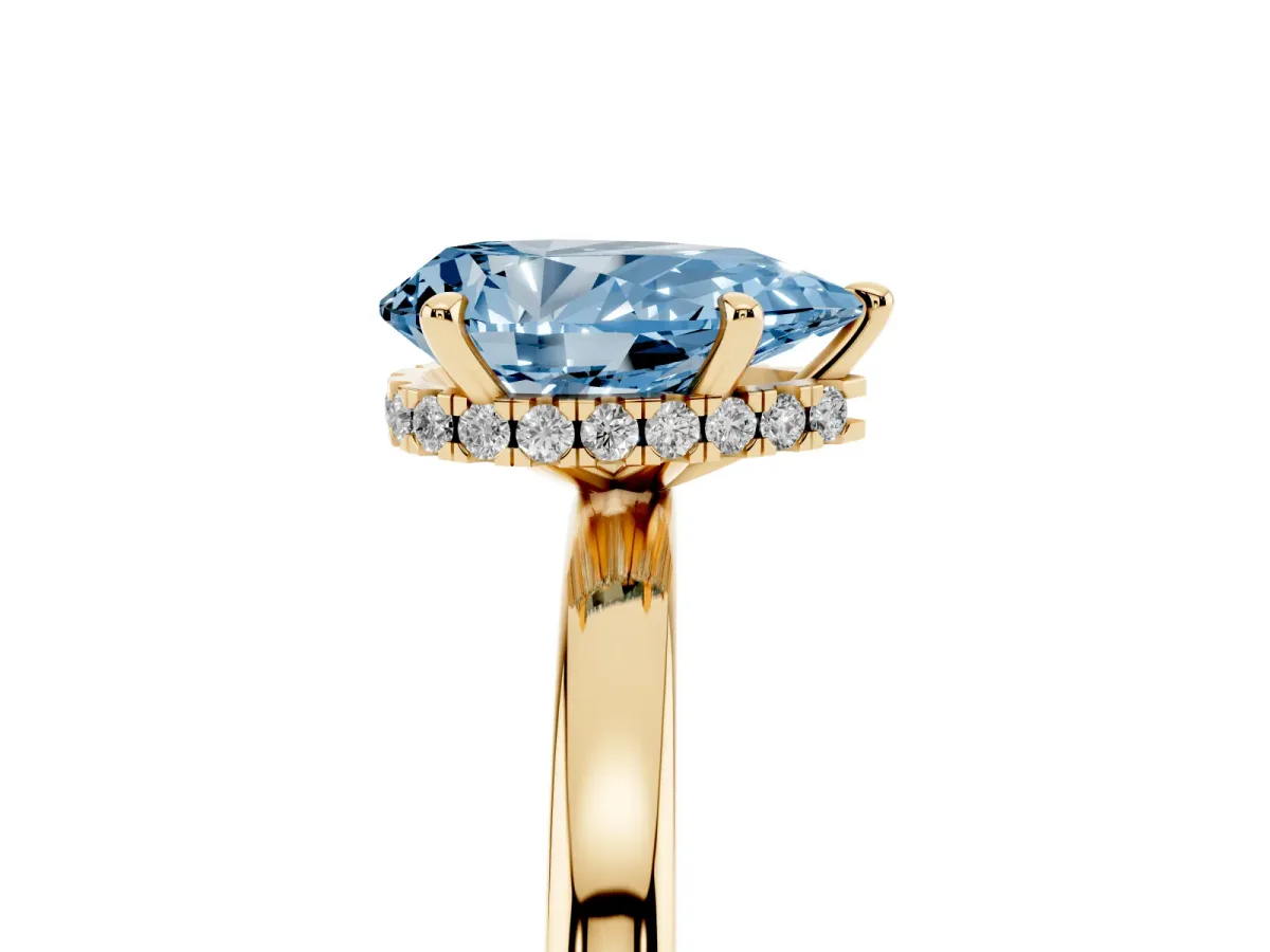 Fancy Blue Pear Cut Solitaire Engagement Ring with Cathedral Band and Four-Prong Setting Yellow gold