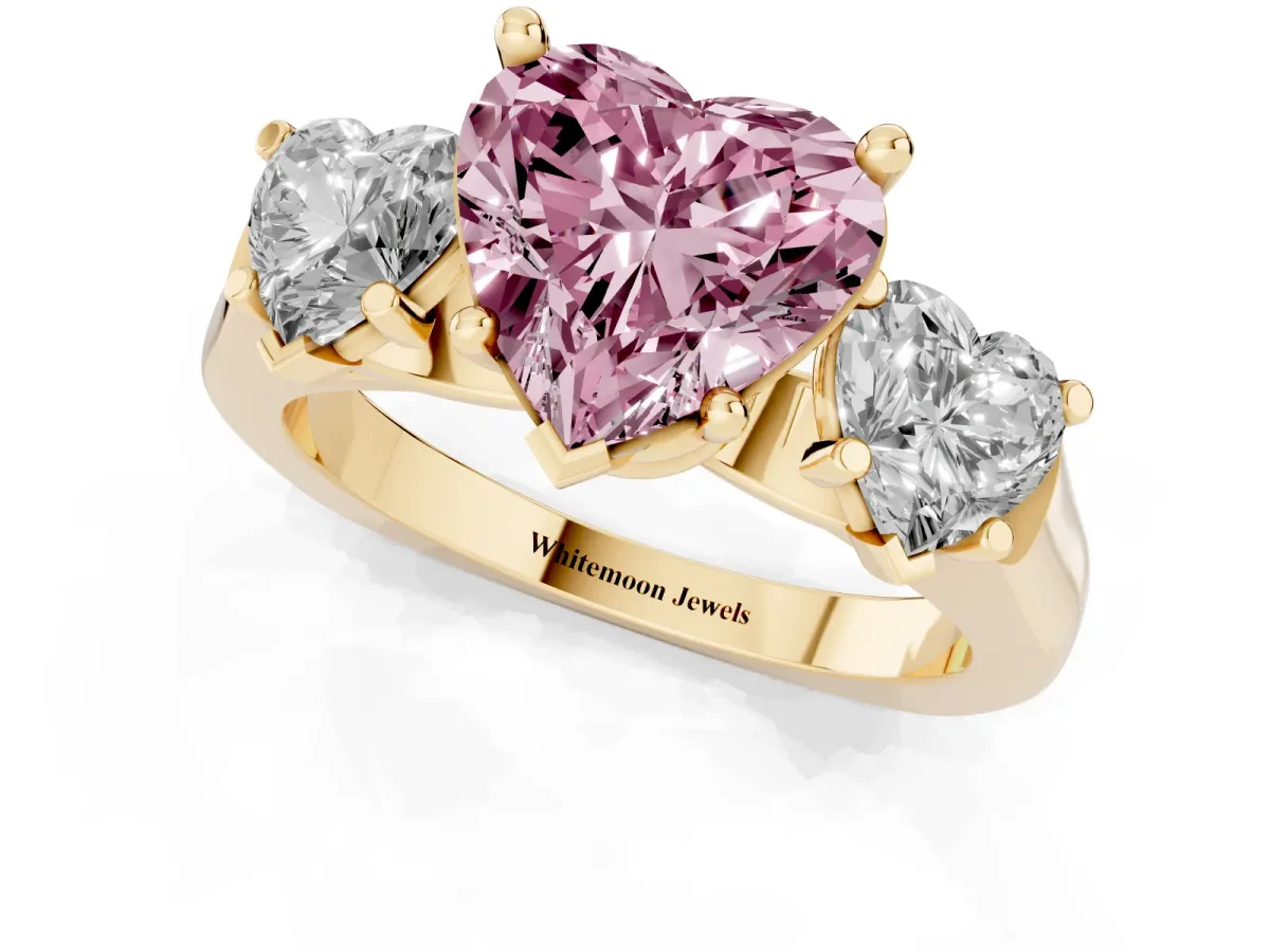 Fancy Pink Three-Stone Heart Cut Brilliant Diamond Trellis Ring with Comfort Fit Band Yellow gold