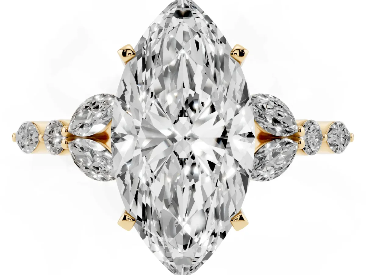 Marquise Cut Diamond Solitaire Ring with Side Stones and Four-Prong Setting Yellow gold