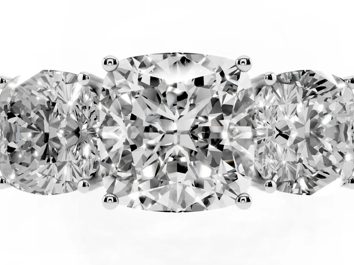 Cushion Cut Diamond Three-Stone Ring with Prong Setting and Textured Band Platinum
