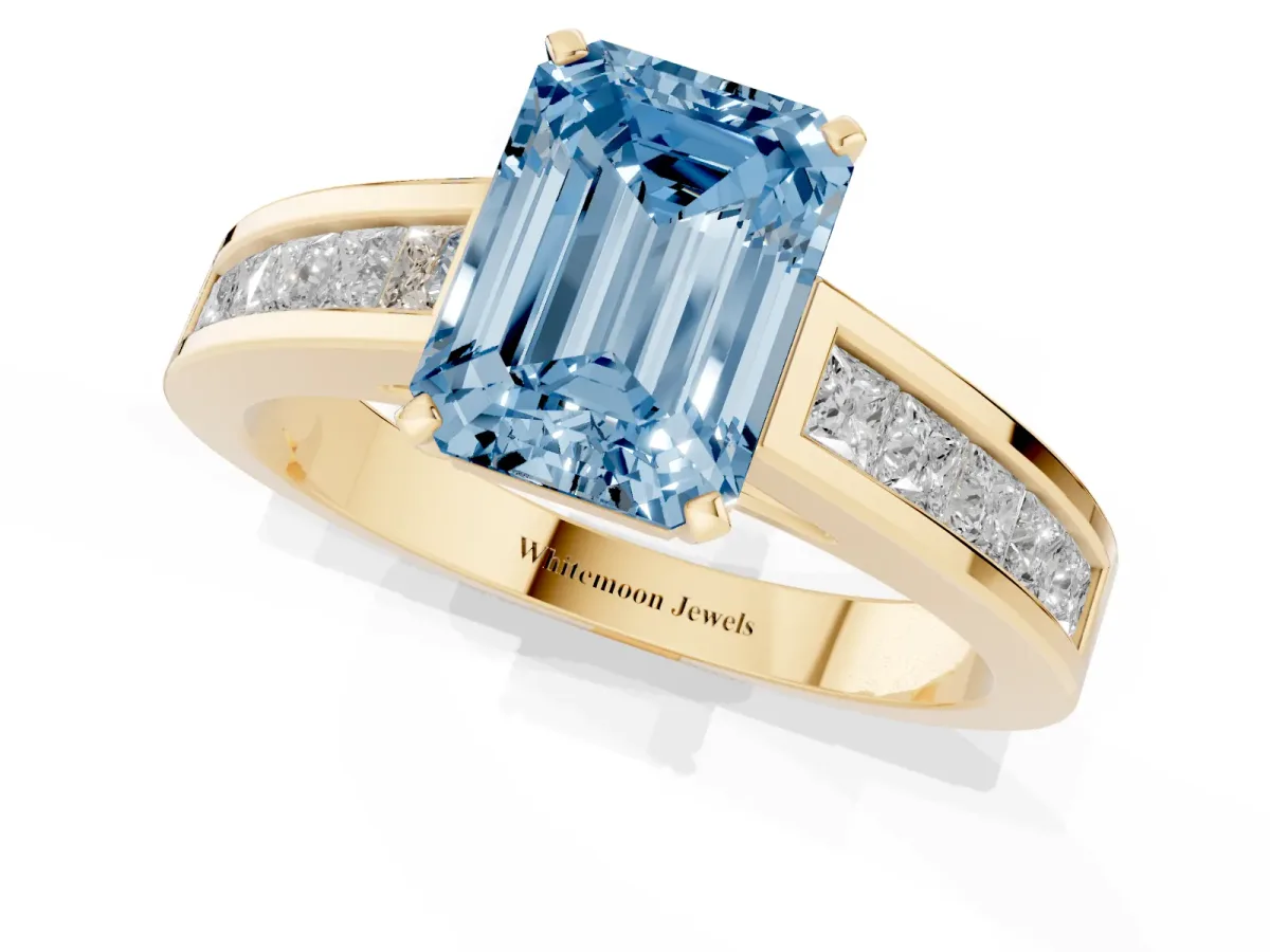 Fancy Blue Emerald Cut Solitaire Diamond Ring with Channel-Set Band and Four-Prong Setting Yellow gold