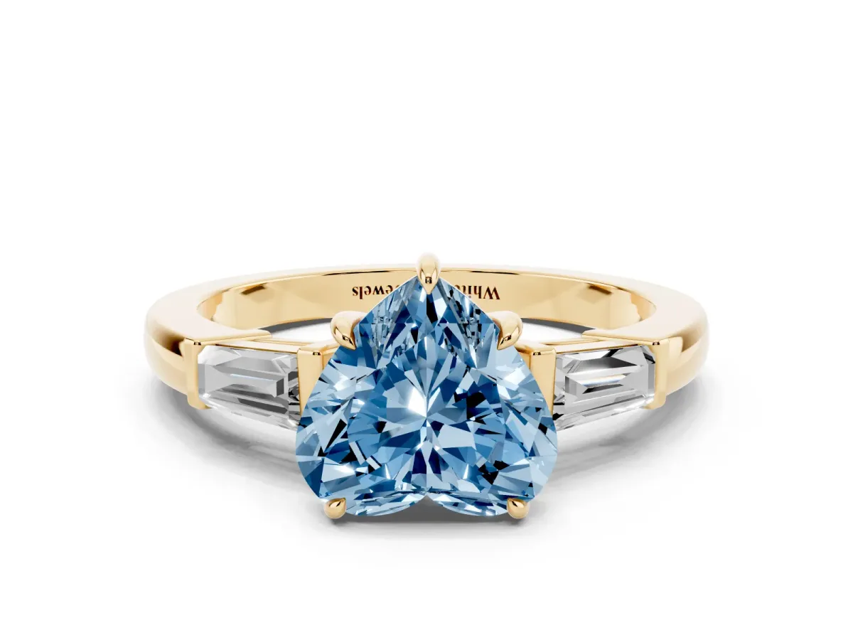 Fancy Blue Heart Cut Diamond Three-Stone Ring with Tapered Baguette Side Stones and Prong Setting Yellow gold