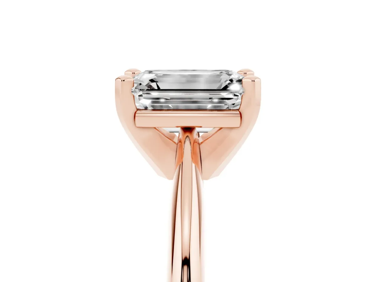 Emerald Cut Cut Solitaire Ring with Four-Prong Setting on a Classic Band Rose gold