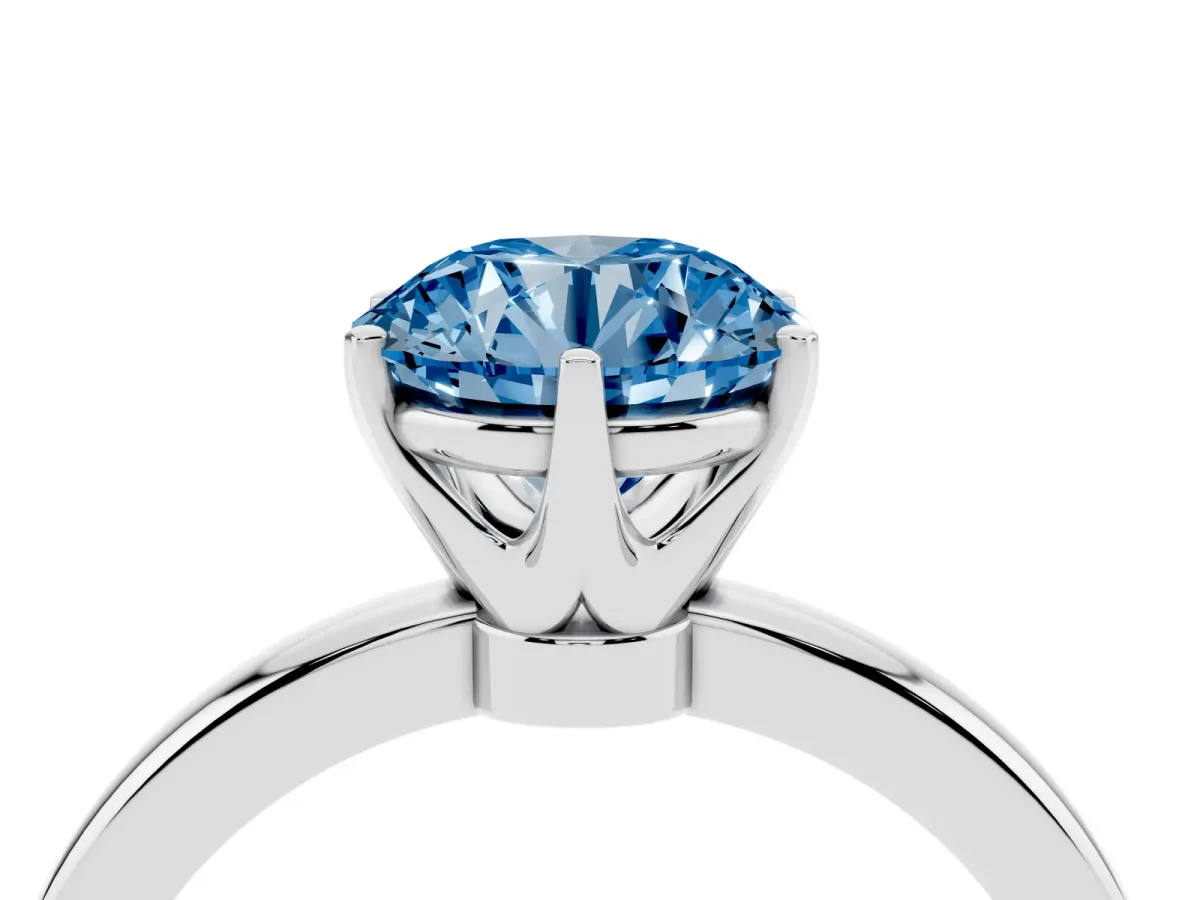 Fancy Blue Round Cut Solitaire Diamond Ring with Six-Prong Setting on a Classic Band Silver