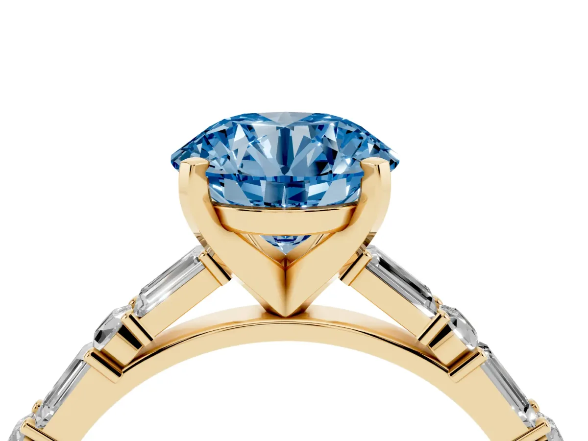 Fancy Blue Round Cut Diamond Solitaire with Side Baguettes and Channel Set Band Yellow gold