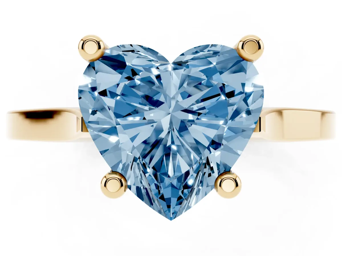Fancy Blue Heart Cut Solitaire Diamond Ring with Four-Prong Setting and Tapered Band Yellow gold