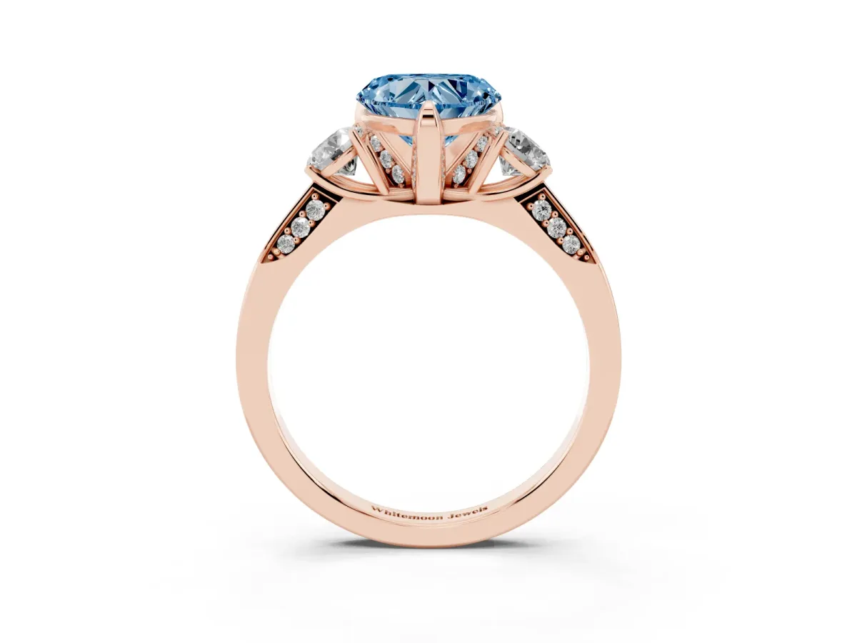 Fancy Blue Heart Cut Brilliant Three-Stone Diamond Ring with Pavé Band and Four-Prong Setting Rose gold