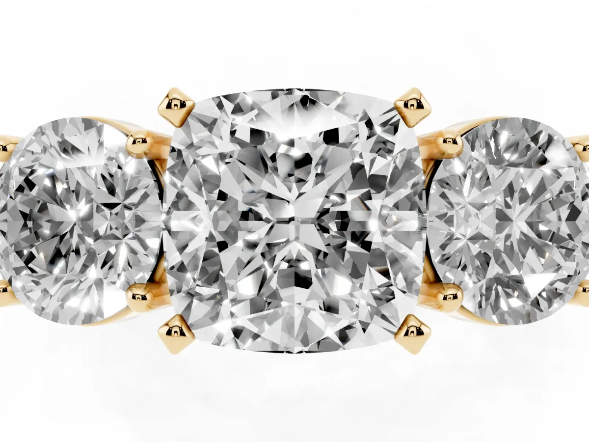Three-Stone Cushion Cut Diamond Ring with Round Side Stones, Classic Band, and Four-Prong Setting Yellow gold