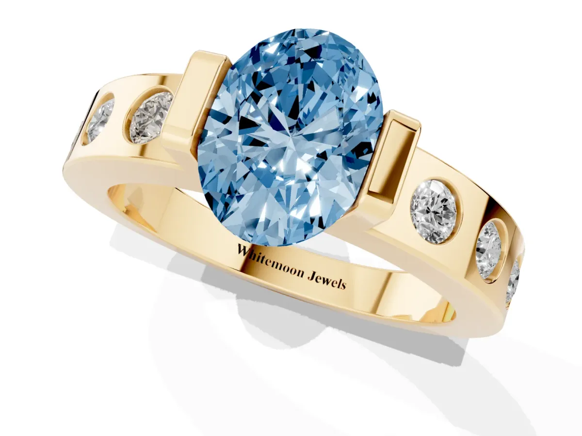 Fancy Blue Oval Cut Brilliant Channel-Set Diamond Ring with Bezel Prong Setting Yellow gold