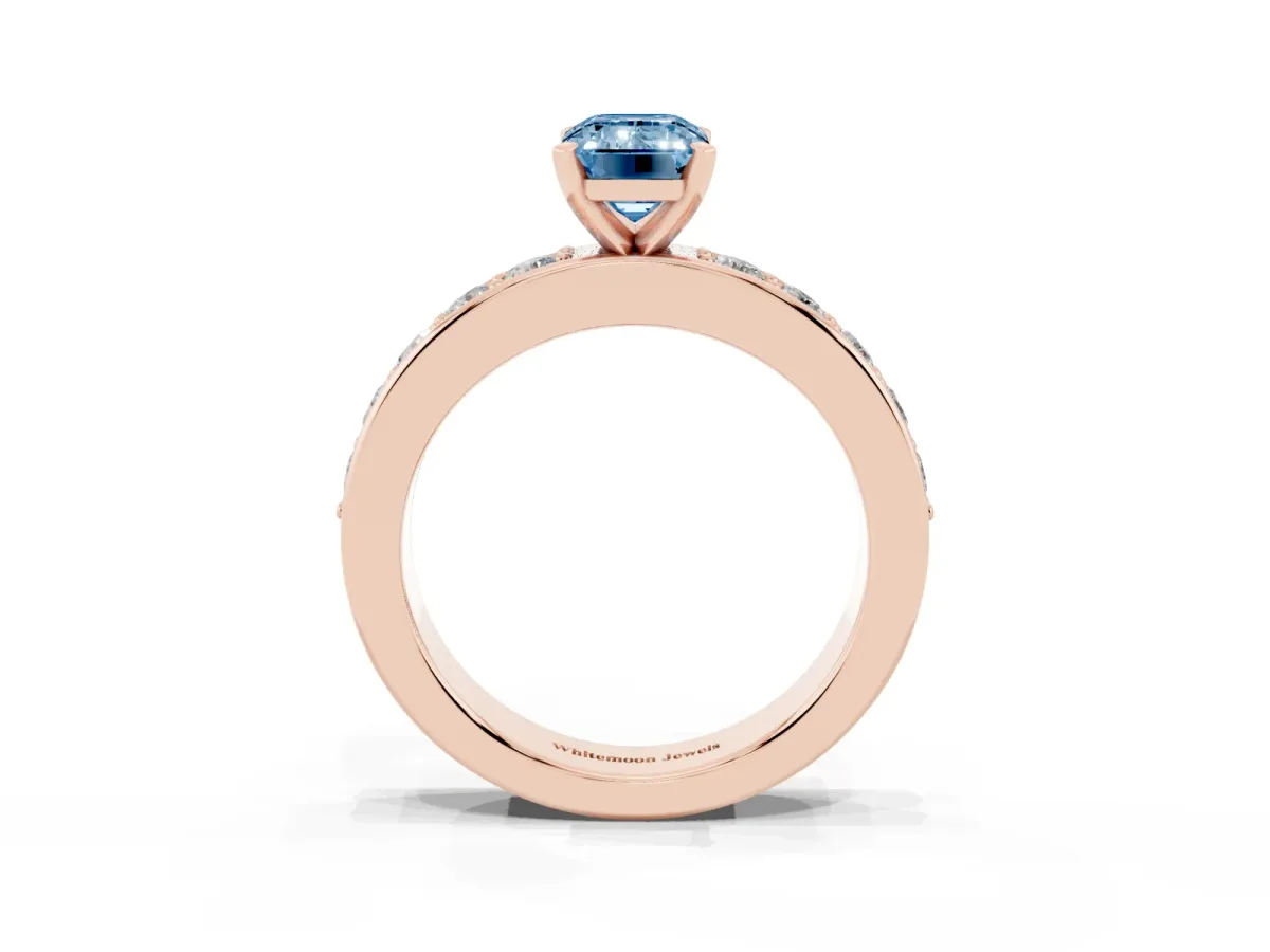 Fancy Blue Emerald Cut Diamond Engagement Ring with Channel Set Round Band and Prong Setting Rose gold
