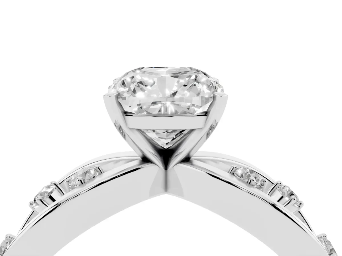 Cushion Cut Cut Solitaire Diamond with Side Stones on Criss-Cross Band and Four-Prong Setting Silver