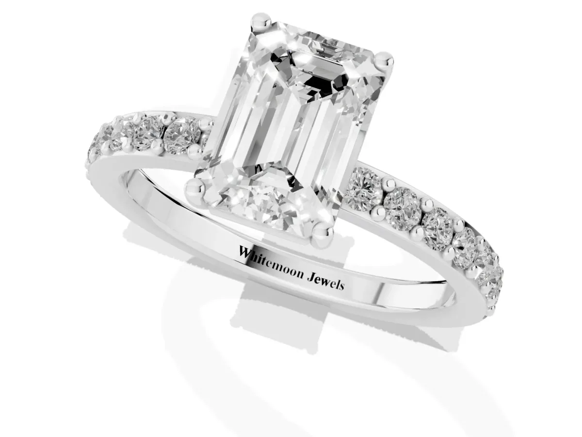 Emerald Cut Cut Diamond Solitaire with Pave Band and Four-Prong Setting Platinum
