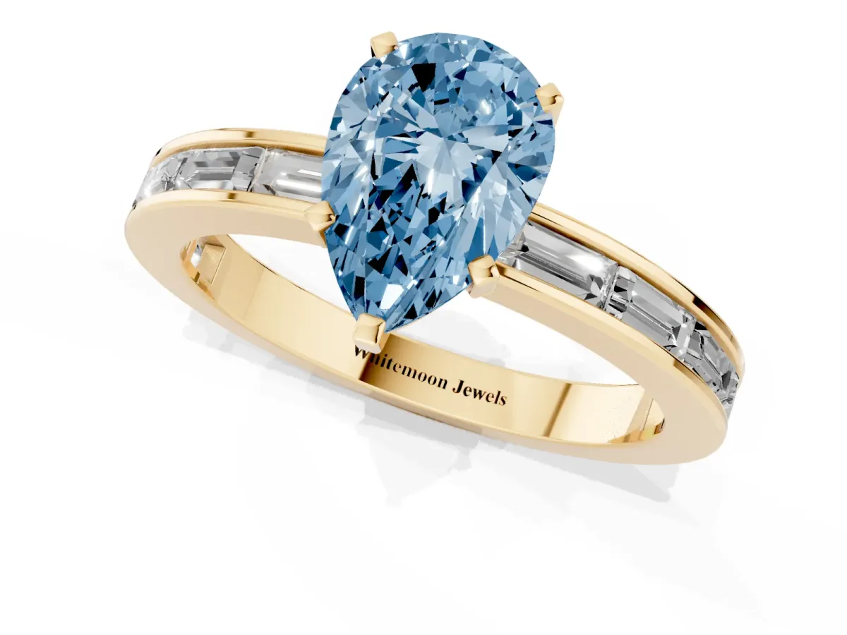 Fancy Blue Pear Cut Solitaire Diamond Ring with Channel-Set Baguette Band and Four-Prong Setting Yellow gold