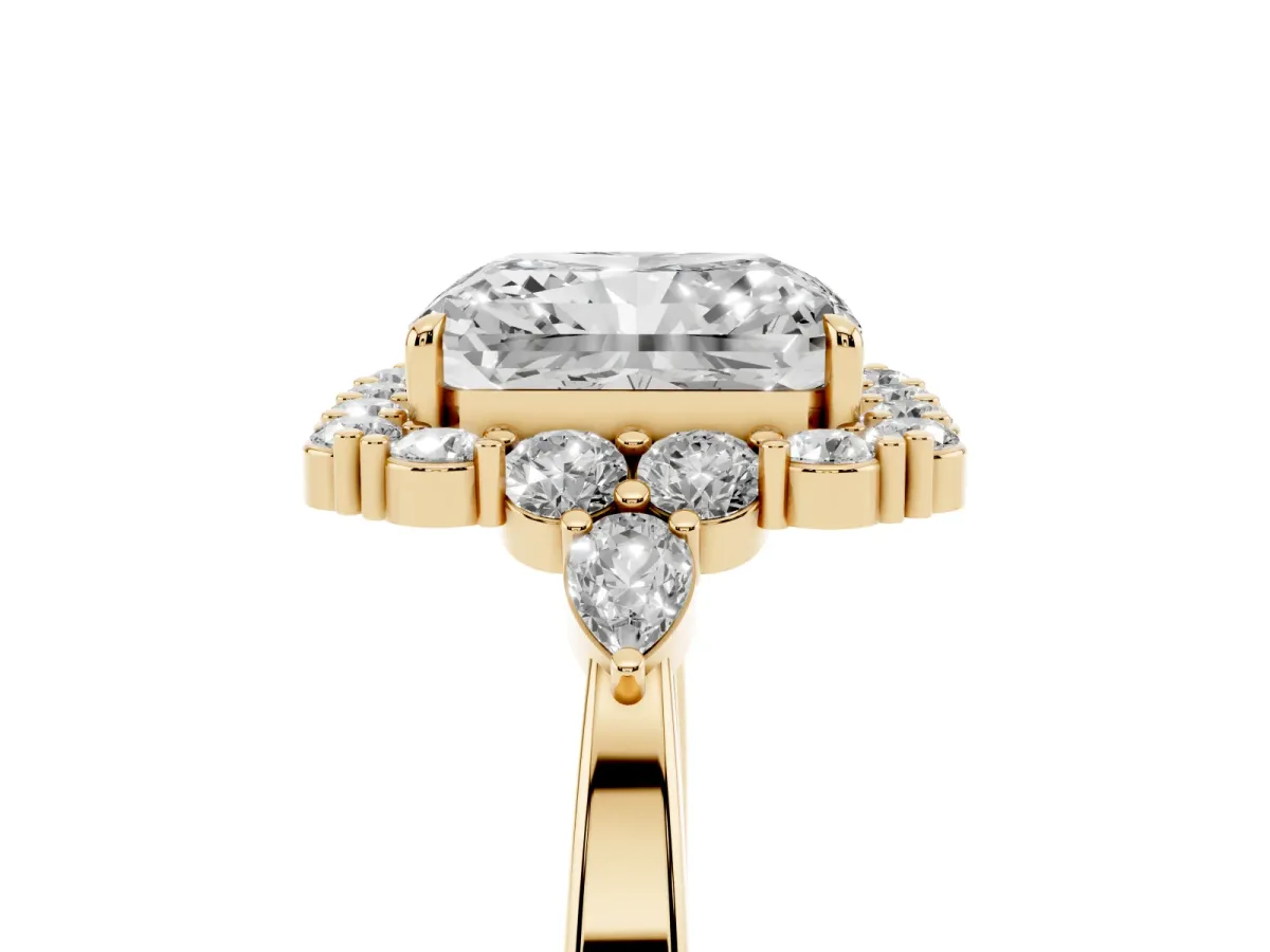 Radiant Cut Diamond Halo Ring with Pear Side Stones and Prong Setting Yellow gold