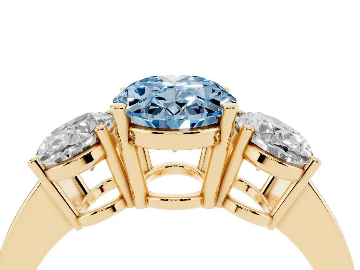 Fancy Blue Three-Stone Oval Cut Cut Diamond Engagement Ring with Flat Band and Four-Prong Setting Yellow gold