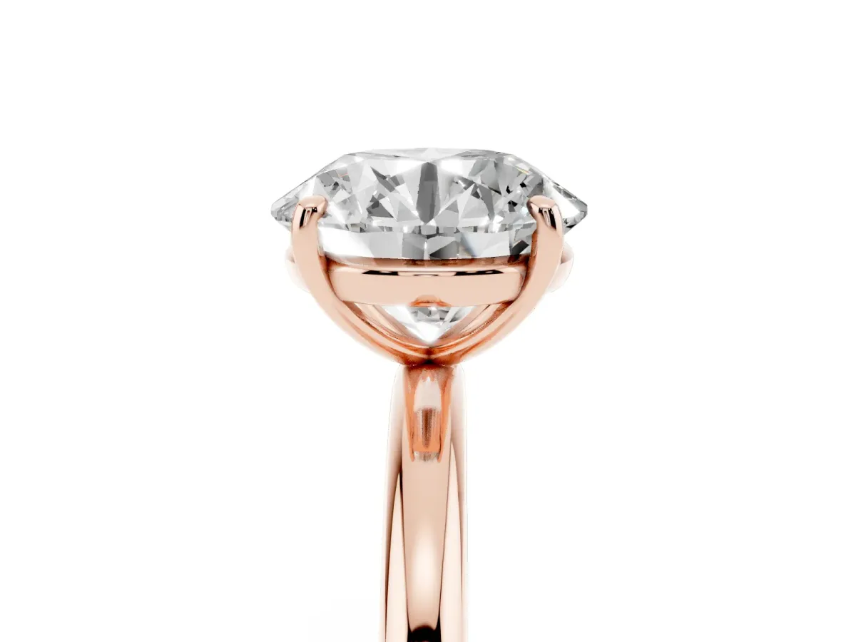 Round Cut Solitaire Diamond Ring with Four-Prong Setting on a Plain Band Rose gold