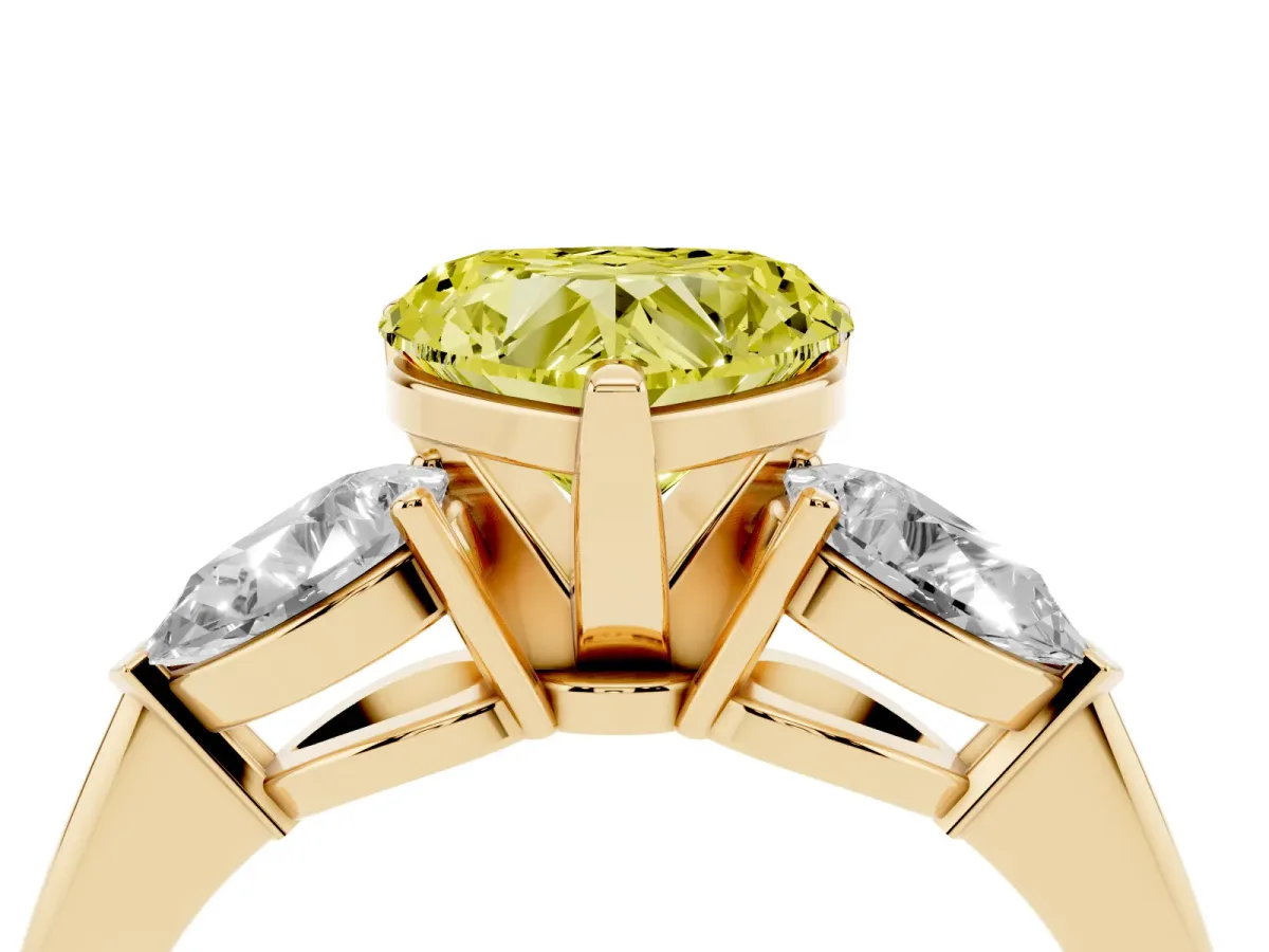 Fancy Yellow Three-Stone Heart Cut Diamond Ring with Pear Side Stones and Four-Prong Setting Yellow gold