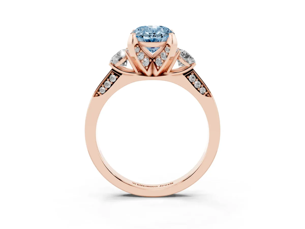 Fancy Blue Oval Cut Brilliant Three-Stone Diamond Ring with Pavé Band and Four-Prong Setting Rose gold