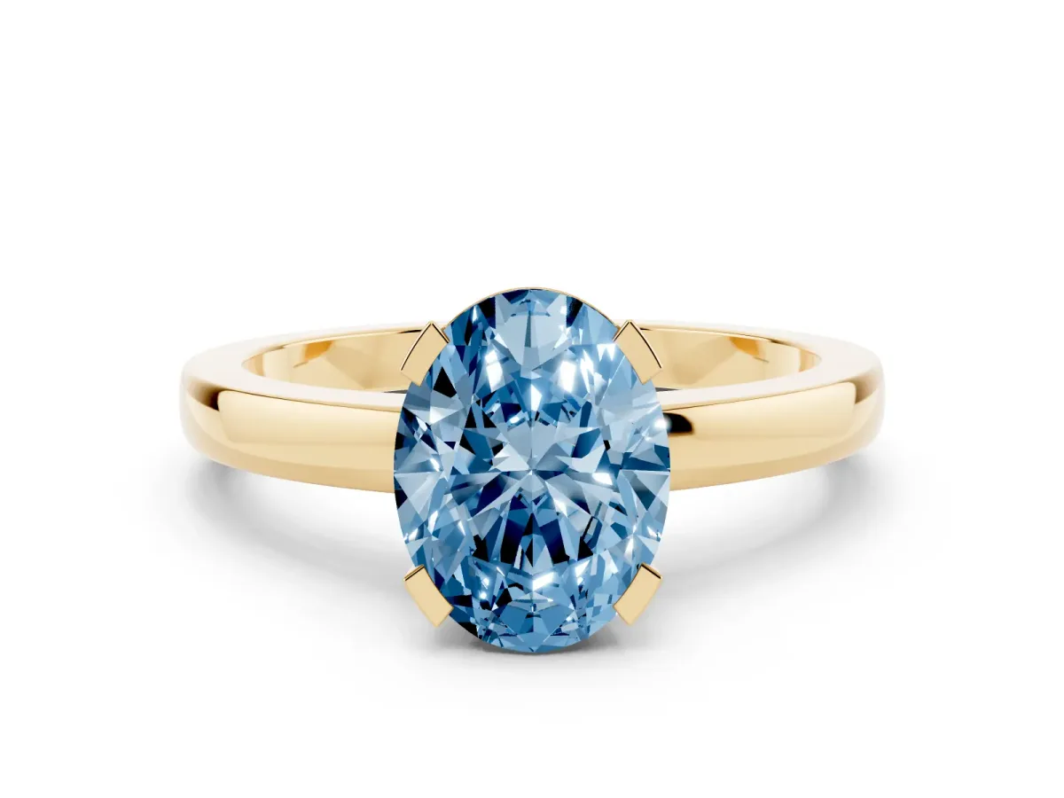 Fancy Blue Oval Cut Cut Solitaire Ring with Four-Prong Setting and Classic Band Yellow gold