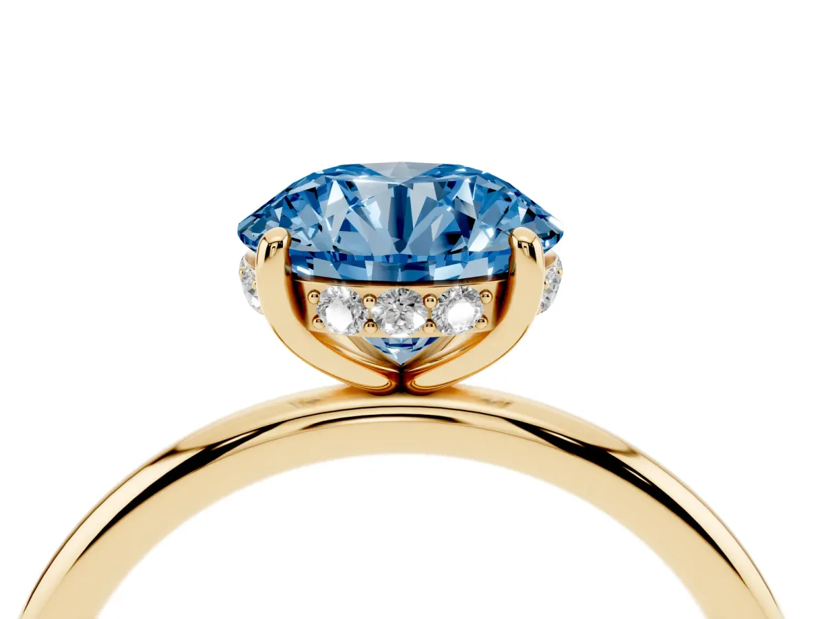 Fancy Blue Round Cut Solitaire Diamond Ring with a Classic Band and Four-Prong Setting Yellow gold