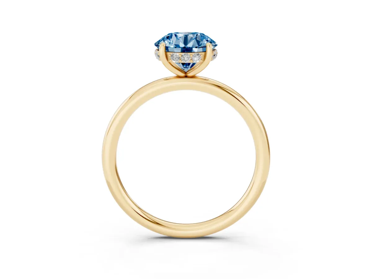 Fancy Blue Round Cut Solitaire Diamond Ring with a Classic Band and Four-Prong Setting Yellow gold