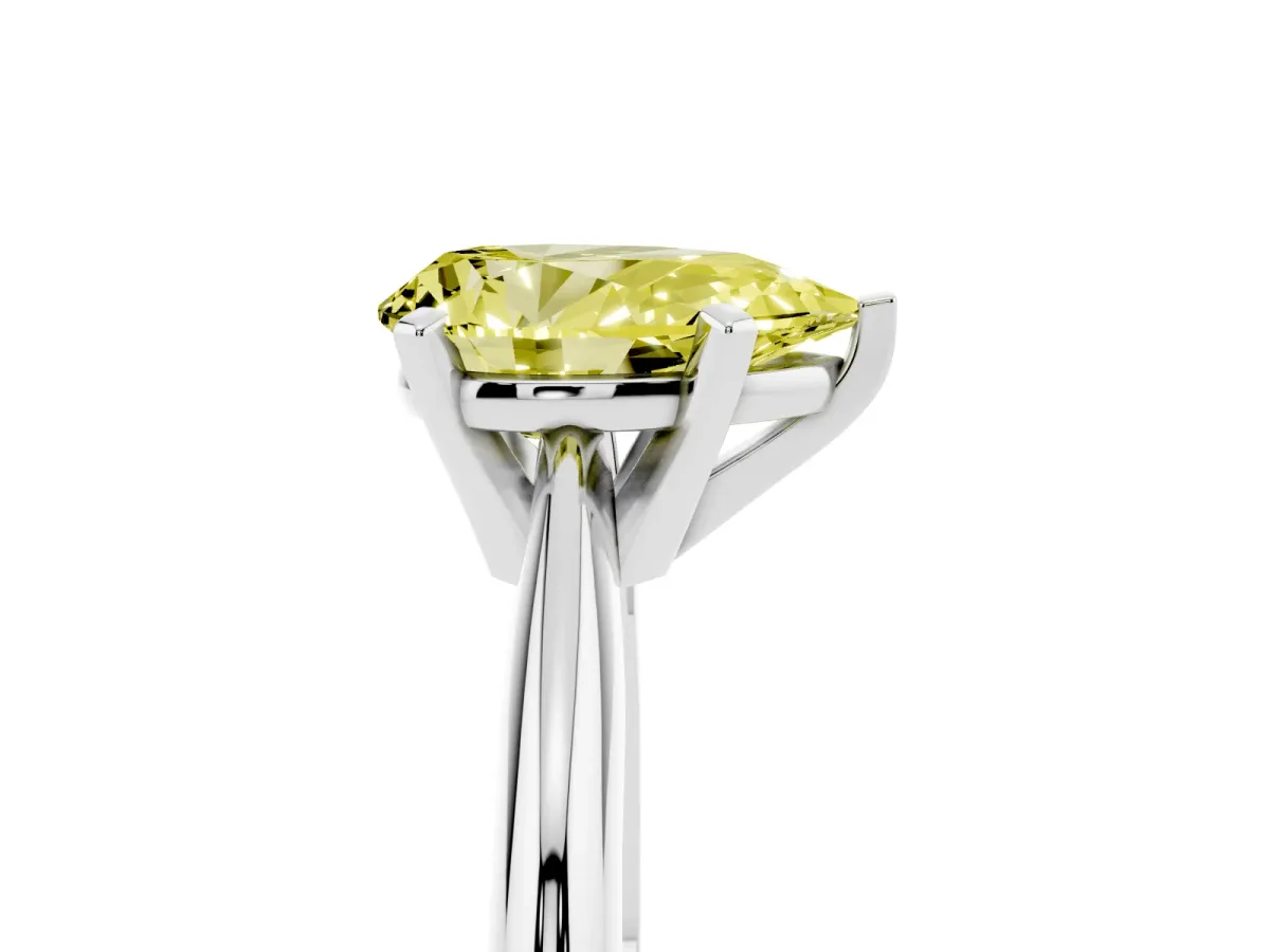 Fancy Yellow Pear Cut Cut Solitaire Ring with Four-Prong Setting on a Classic Band Silver