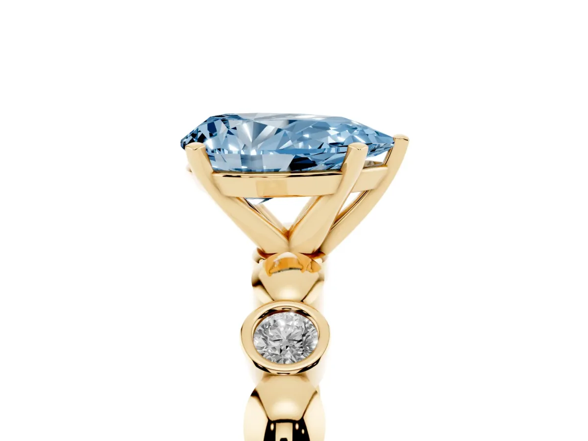 Fancy Blue Pear Cut Solitaire Bezel-Set Diamond Ring with Beaded Band and Four-Prong Setting Yellow gold