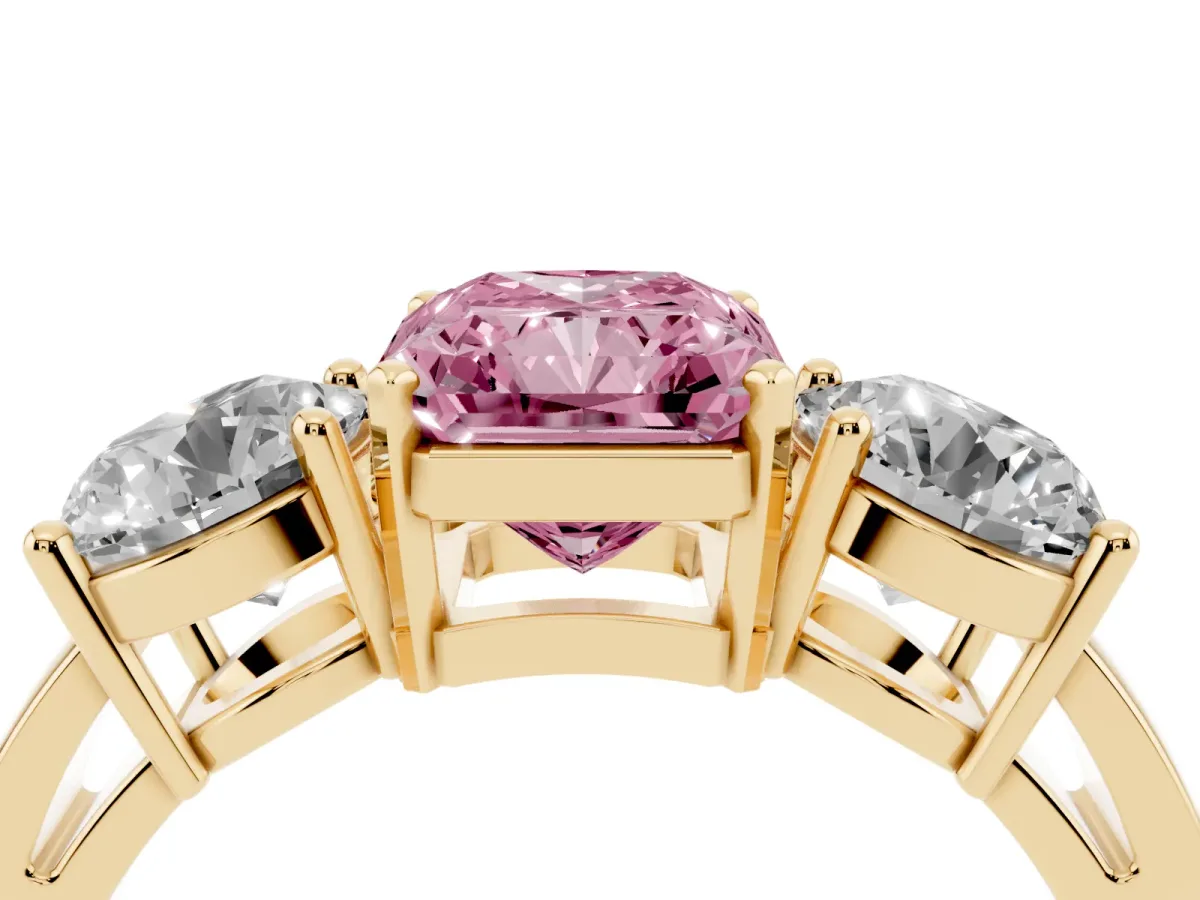 Fancy Pink Three-Stone Radiant Cut Diamond Ring with Round Side Stones, Classic Band, and Four-Prong Setting Yellow gold