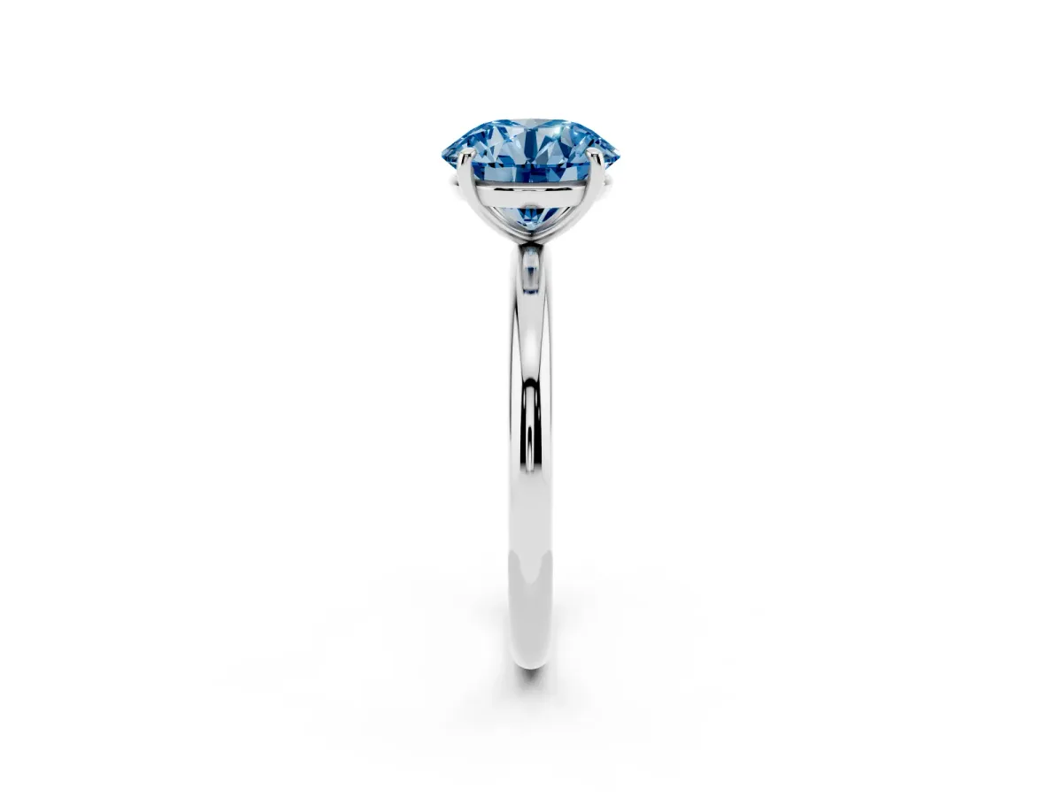 Fancy Blue Round Cut Solitaire Diamond Ring with Four-Prong Setting on a Plain Band Silver