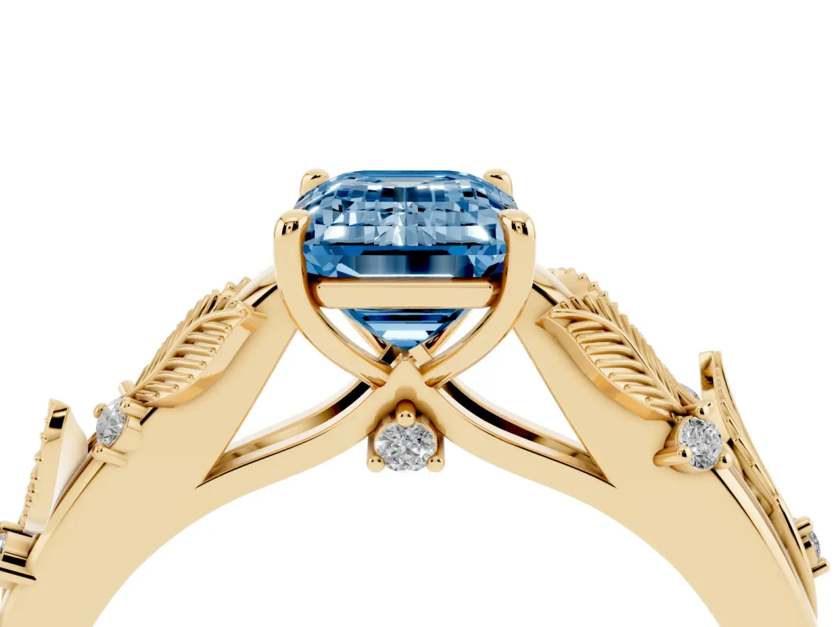 Fancy Blue Emerald Cut Diamond Solitaire Ring with Leaf Motif Band and Four-Prong Setting Yellow gold