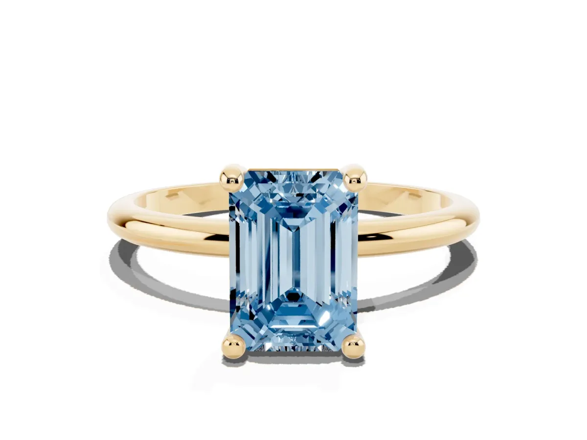 Fancy Blue Emerald Cut Solitaire Diamond Ring with 4-Prong Setting on a Classic Band Yellow gold