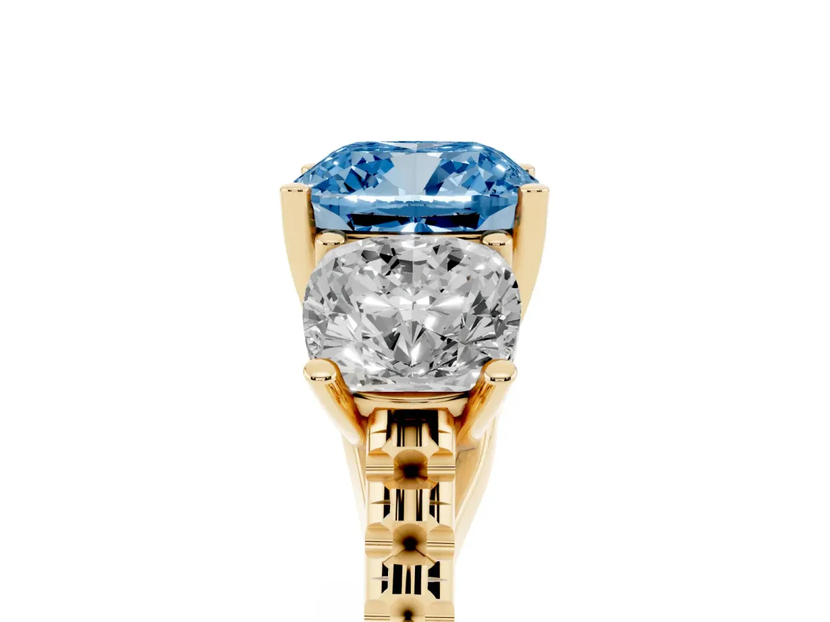 Fancy Blue Three-Stone Cushion Cut Diamond Ring with Round Pavé Band and Prong Setting Yellow gold