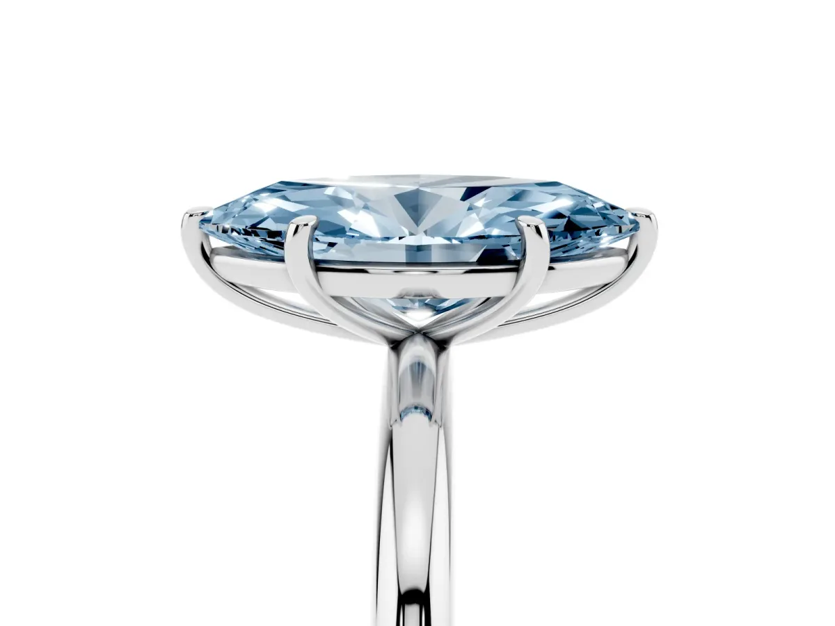 Fancy Blue Oval Cut Solitaire Diamond Ring with Four-Prong Setting on a Plain Band Platinum