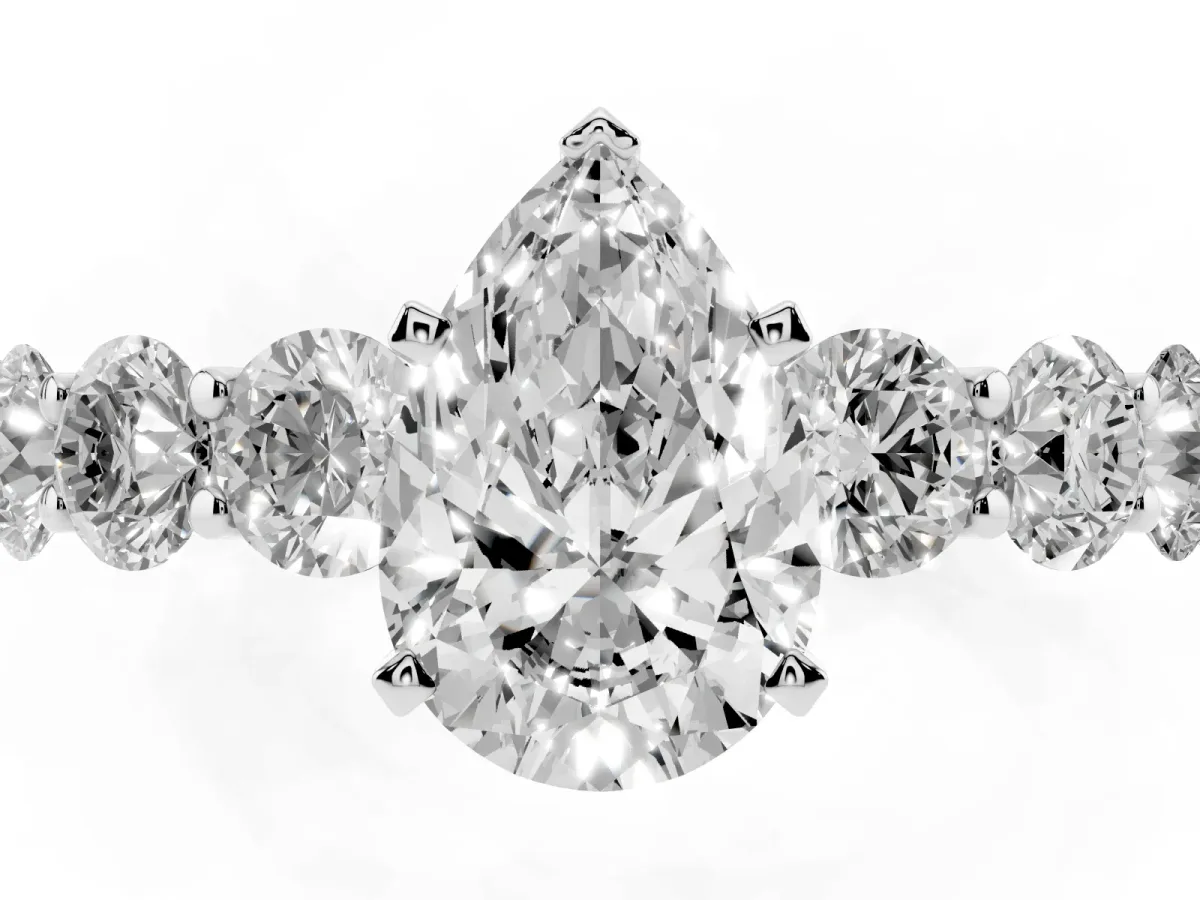 Pear Cut Diamond Prong Setting with Side Stones on a Pave Band Silver