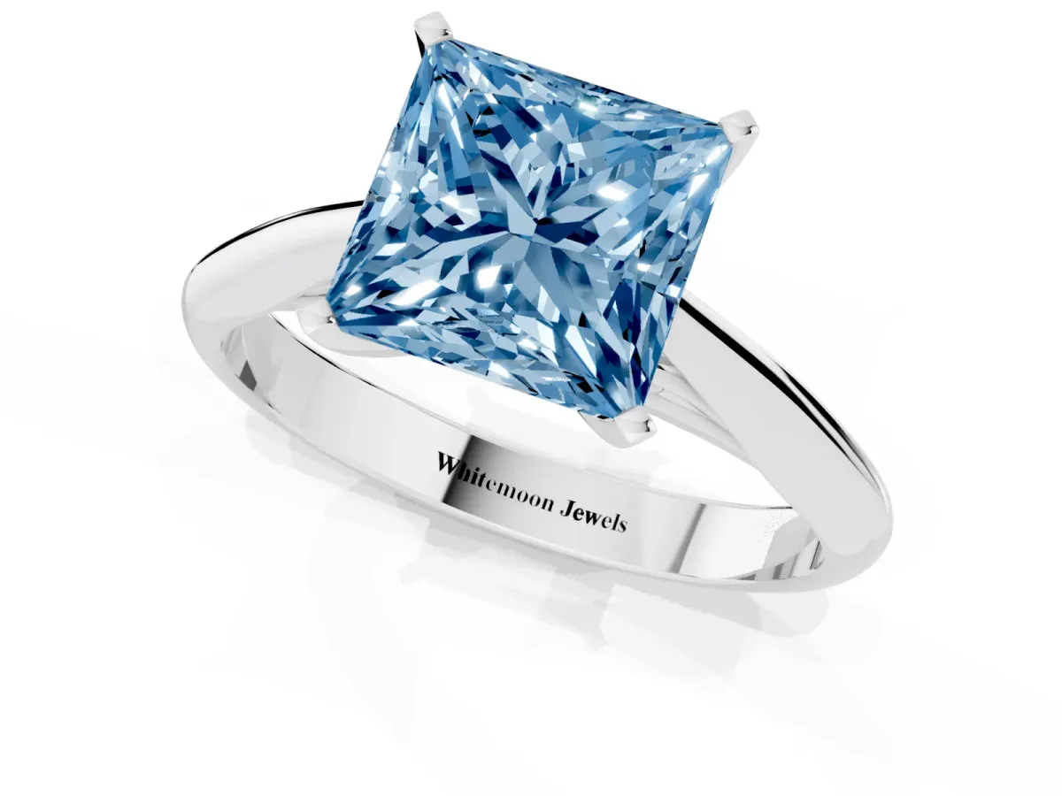 Fancy Blue Princess Cut Diamond Solitaire Engagement Ring with Cathedral Setting and Four-Prong Mount Platinum