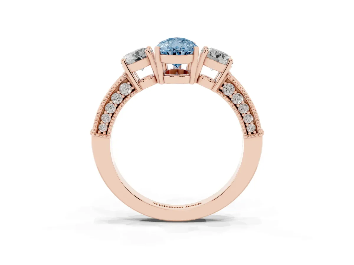 Fancy Blue Pear Cut Three-Stone Diamond Ring with Pavé Band and Four-Prong Setting Rose gold