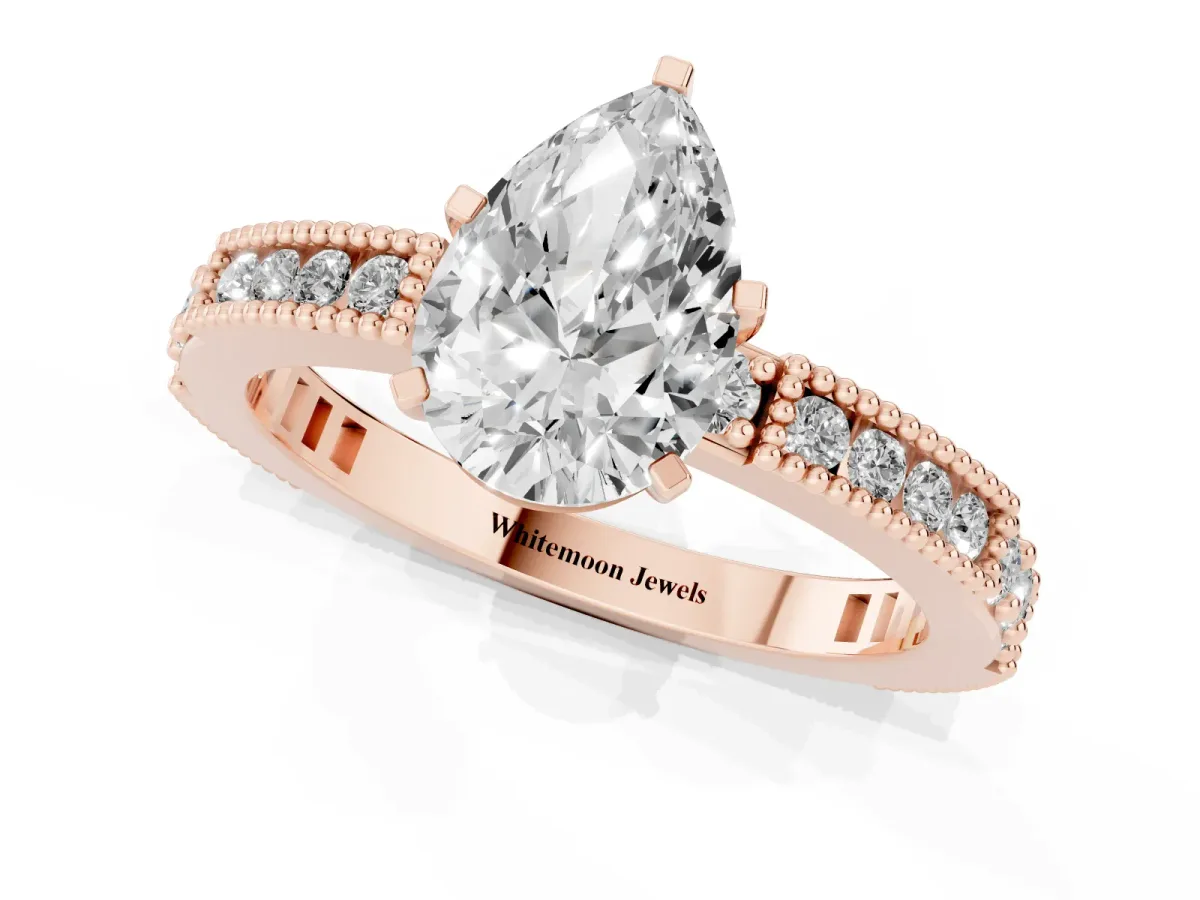 Pear Cut Solitaire with Pavé Band and Four-Prong Setting Rose gold